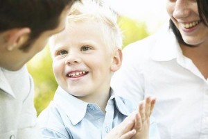 parents-with-young-boy-smiling_2-450x300
