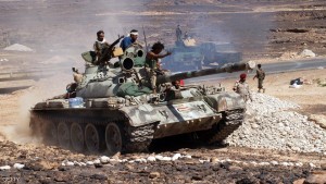 Yemeni soldiers ride a tank after taking hold of a major Al-Qaeda stronghold Azzan in the southern province of Shabwa, on May 8, 2014. Yemen's army seized control of Azzan as an offensive against militants entered its tenth day, the defence ministry announced. AFP PHOTO / STR (Photo credit should read STR/AFP/Getty Images)