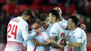 Sevilla's Danish midfielder Michael Krohn-Dehli (2ndL) celebrates with teammates after scoring during the Spanish Copa del Rey (King's Cup) semifinal first leg football match Sevilla FC vs RC Celta de Vigo at the Ramon Sanchez Pizjuan stadium in Sevilla on February 4, 2016. Sevilla won 4-0.   AFP PHOTO/ CRISTINA QUICLER / AFP / CRISTINA QUICLER        (Photo credit should read CRISTINA QUICLER/AFP/Getty Images)