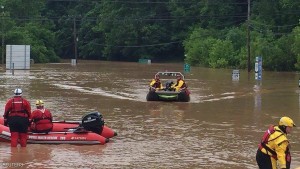 Emergency crews take out boats on a flooded I-79 at the Clendenin Exit in Kanawha County